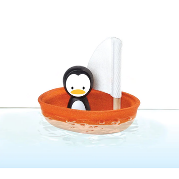 Juguete de baño barco con pingüino
