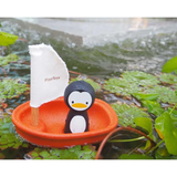 Juguete de baño barco con pingüino