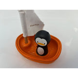 Juguete de baño barco con pingüino
